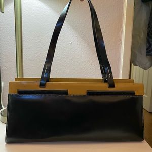 black and tan sleek rectangular purse